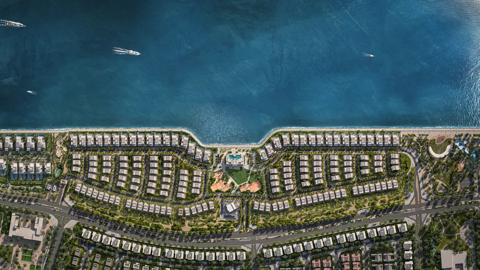 Bashayer Villas: aerial view of the villa rows beside the channel, developer render
