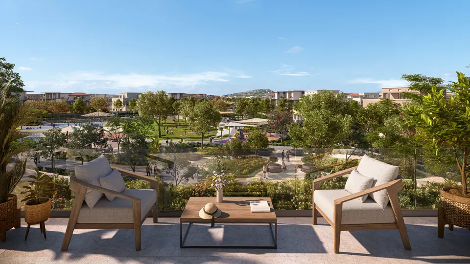 Wadeem: outdoor terrace seating overlooking the community, developer render