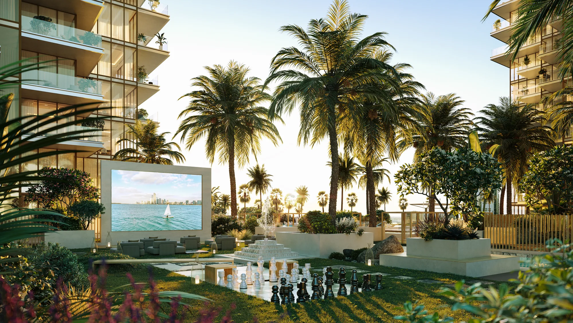 The outdoor movie screen and giant chess set on the podium lawn between the towers