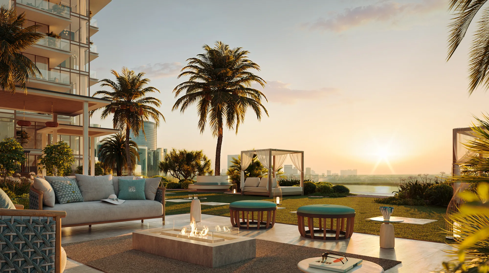 The sea-facing sunset social garden: lounge seating around a fire pit, a cabana and a lawn at sunset