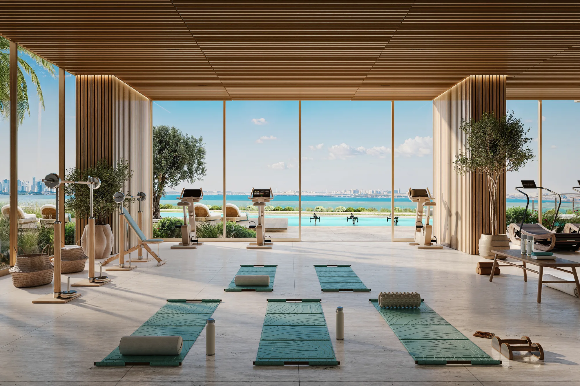 The podium gym: yoga mats and training equipment in a pavilion open to the pool and the sea