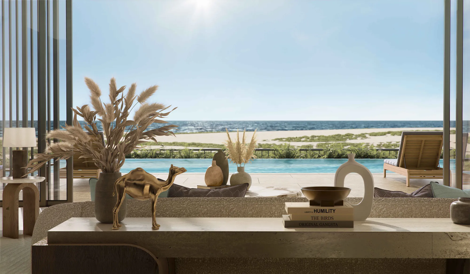 A terrace seen through sheer curtains: the pool deck, the beach and the sea beyond