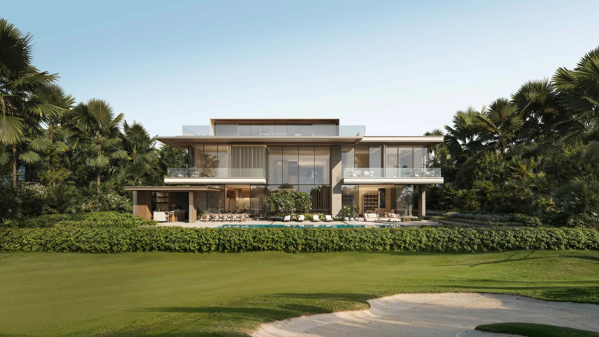 A villa’s garden side on the edge of the golf course, a bunker in the foreground