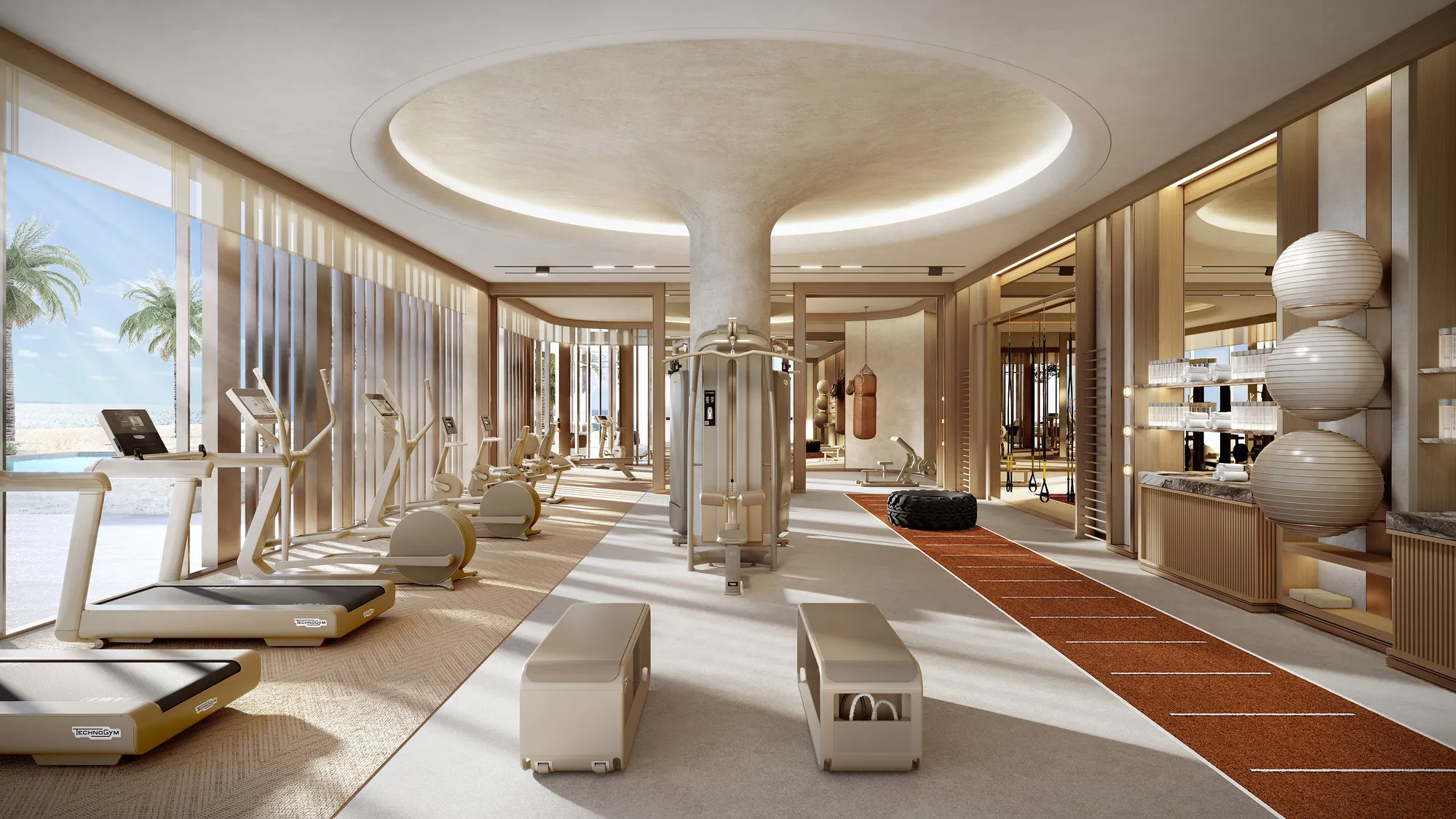 The gym: cardio and strength equipment under an oval ceiling, opening to the pool