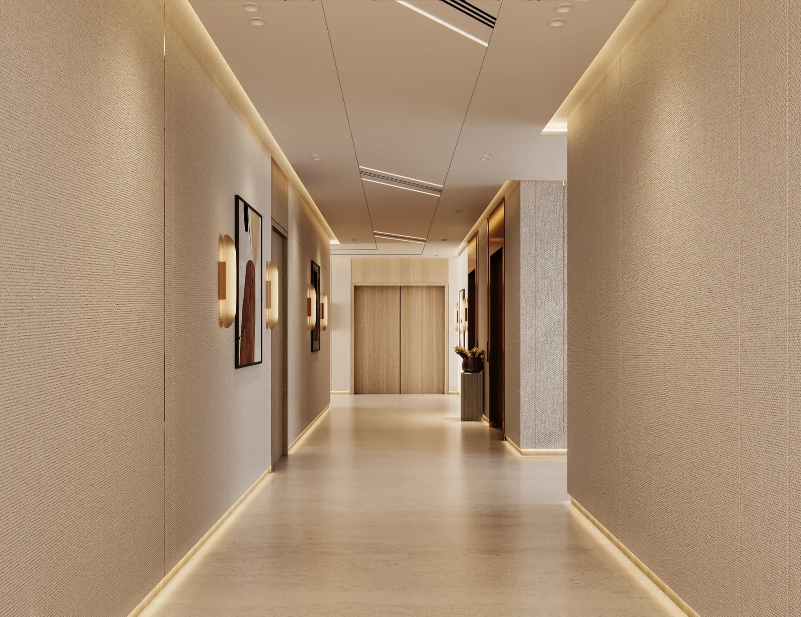 A residential corridor: cream walls, framed prints and wall lights, apartment doors and a window at the end