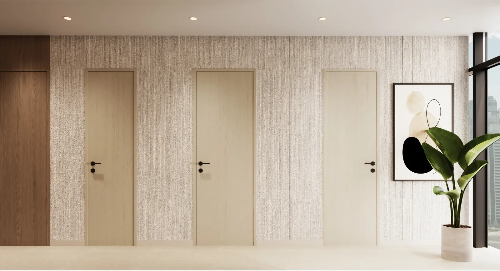 The spa corridor: three cream doors, a framed abstract print and a plant on a textured wall