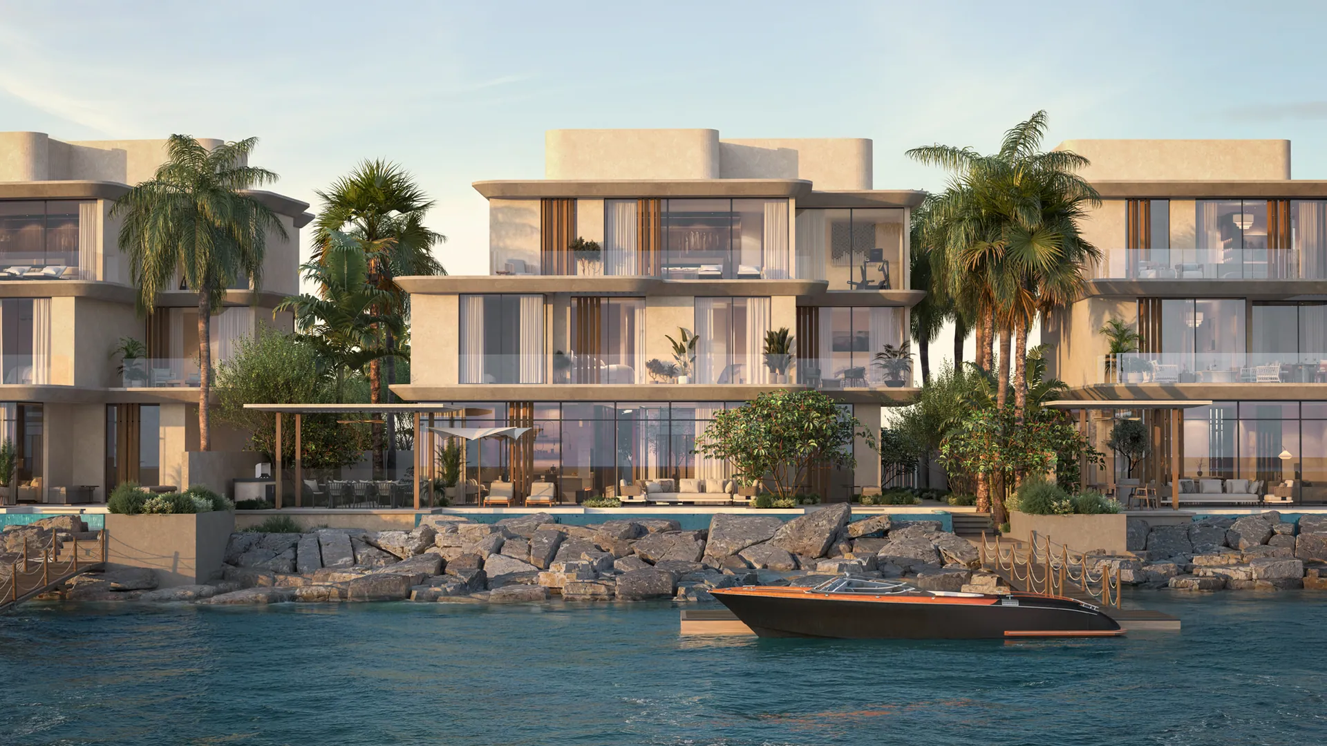 The four-bedroom villa from the water: three storeys of glass and stone between palms, a boat at its dock